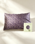 Purple patterned pillowcase with a green label on a beige background - 100% 6A Grade Mulberry silk