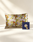 Floral-patterned pillowcase on a bed with a card beside it - 100% 6A Grade Mulberry silk