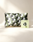 Floral-patterned pillowcase on a beige background with a brand label - 100% 6A Grade Mulberry silk
