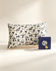 Floral-patterned pillowcase and a box with a floral design on a light background. 100% Mulberry Silk Pillowcase in 25 Momme