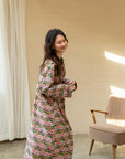 Model wearing an elegant bamboo cotton robe with oriental patterns, featuring a relaxed fit and a green sash, perfect for loungewear and home comfort
