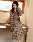 Model wearing an elegant bamboo cotton robe with oriental patterns, featuring a relaxed fit and a green sash, perfect for loungewear and home comfort