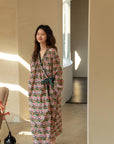 Model wearing an elegant bamboo cotton robe with oriental patterns, featuring a relaxed fit and a green sash, perfect for loungewear and home comfort