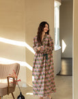 Model wearing an elegant bamboo cotton robe with oriental patterns, featuring a relaxed fit and a green sash, perfect for loungewear and home comfort