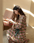 Model wearing an elegant bamboo cotton robe with oriental patterns, featuring a relaxed fit and a green sash, perfect for loungewear and home comfort